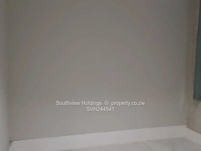 Neat office to let, Upper CBD. Gross rent USD260.00 per month.